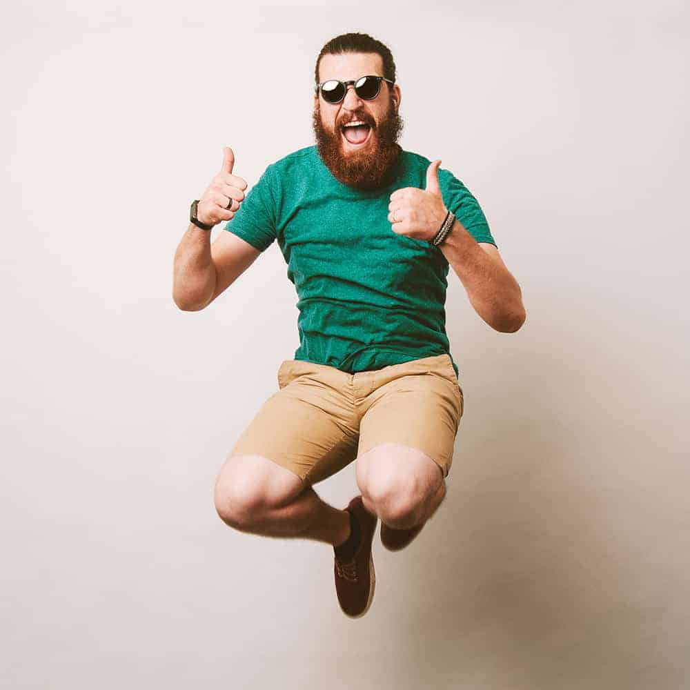 Cheerful bearded hipster man with sunglasses